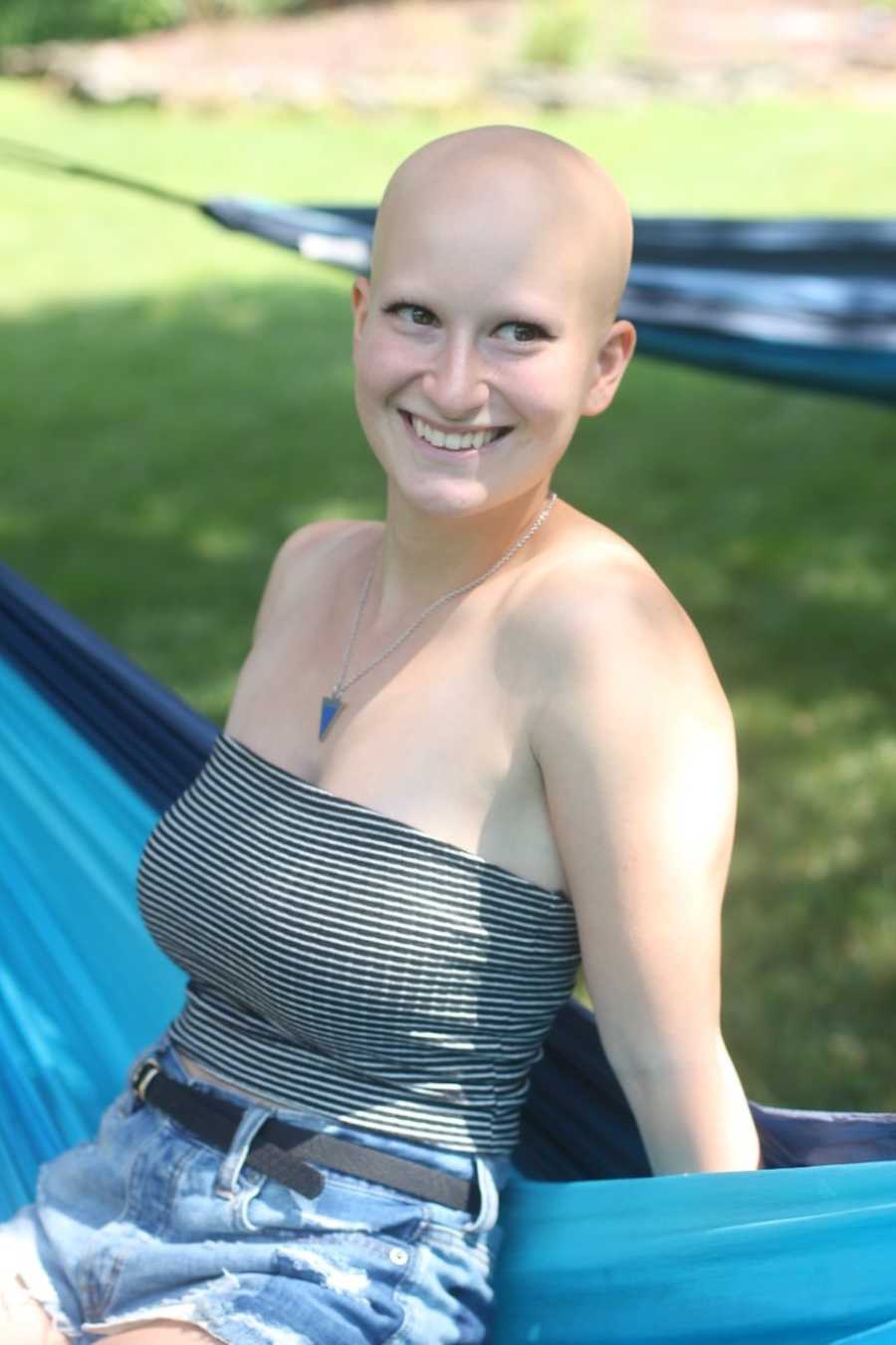 Woman with alopecia smiling in the sun