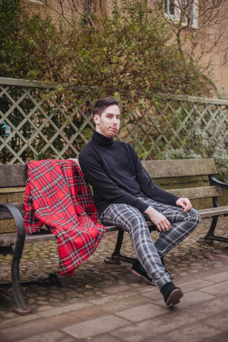 Scottish man sitting on bench