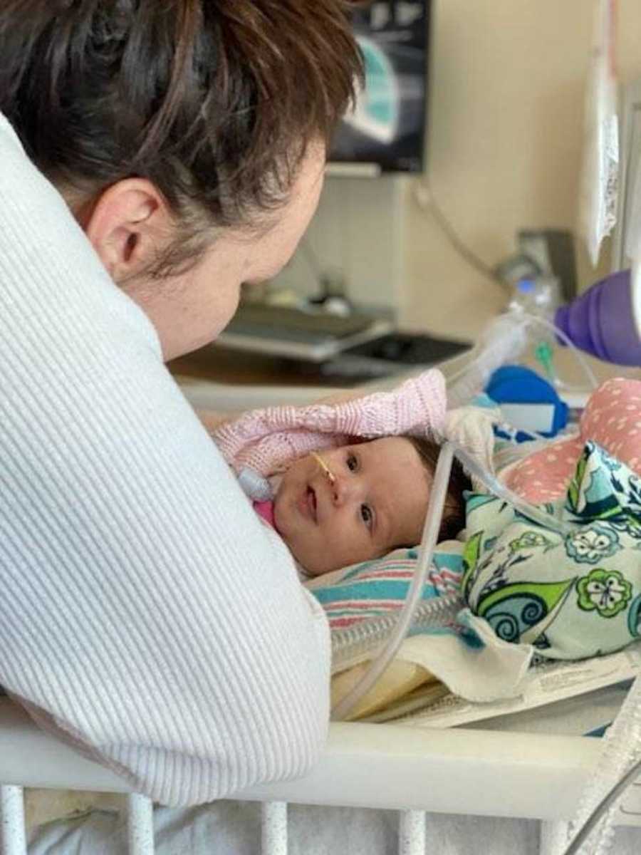 Baby smiling at mom in hospital