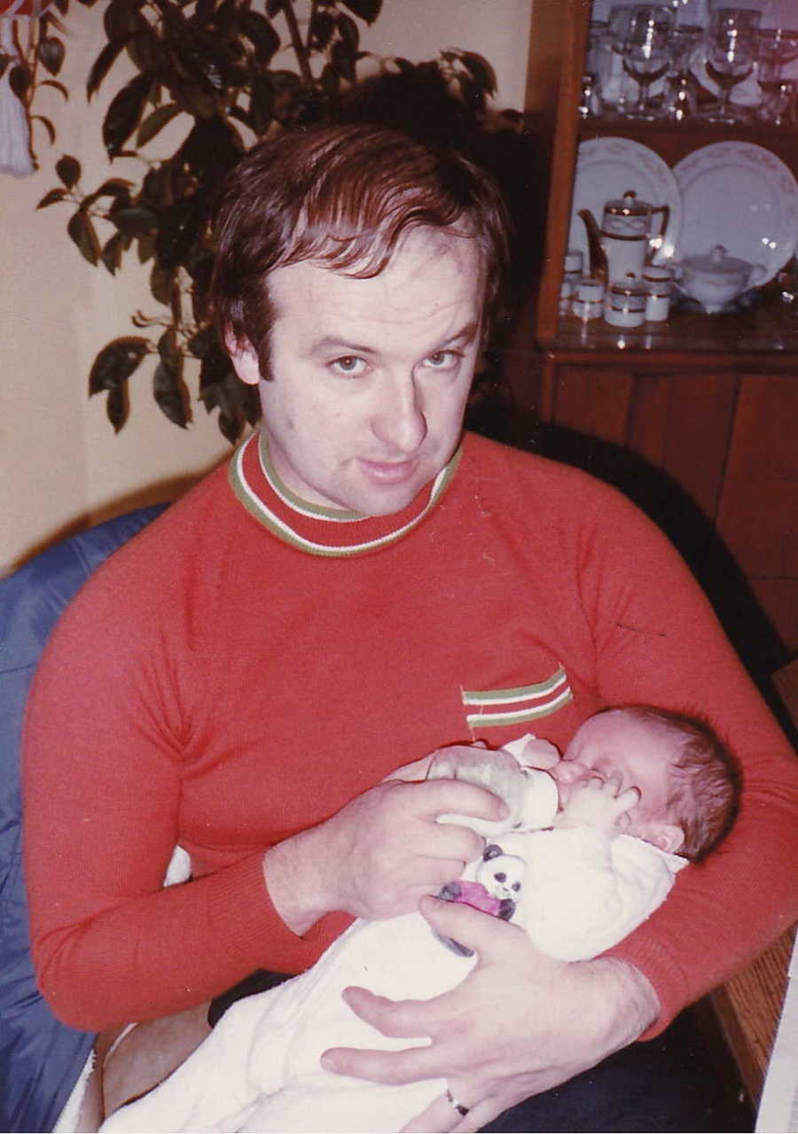 Father holding newborn