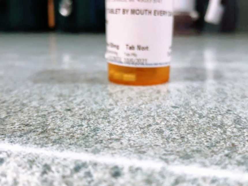 A bottle of anxiety medication sat on top of a granite countertop