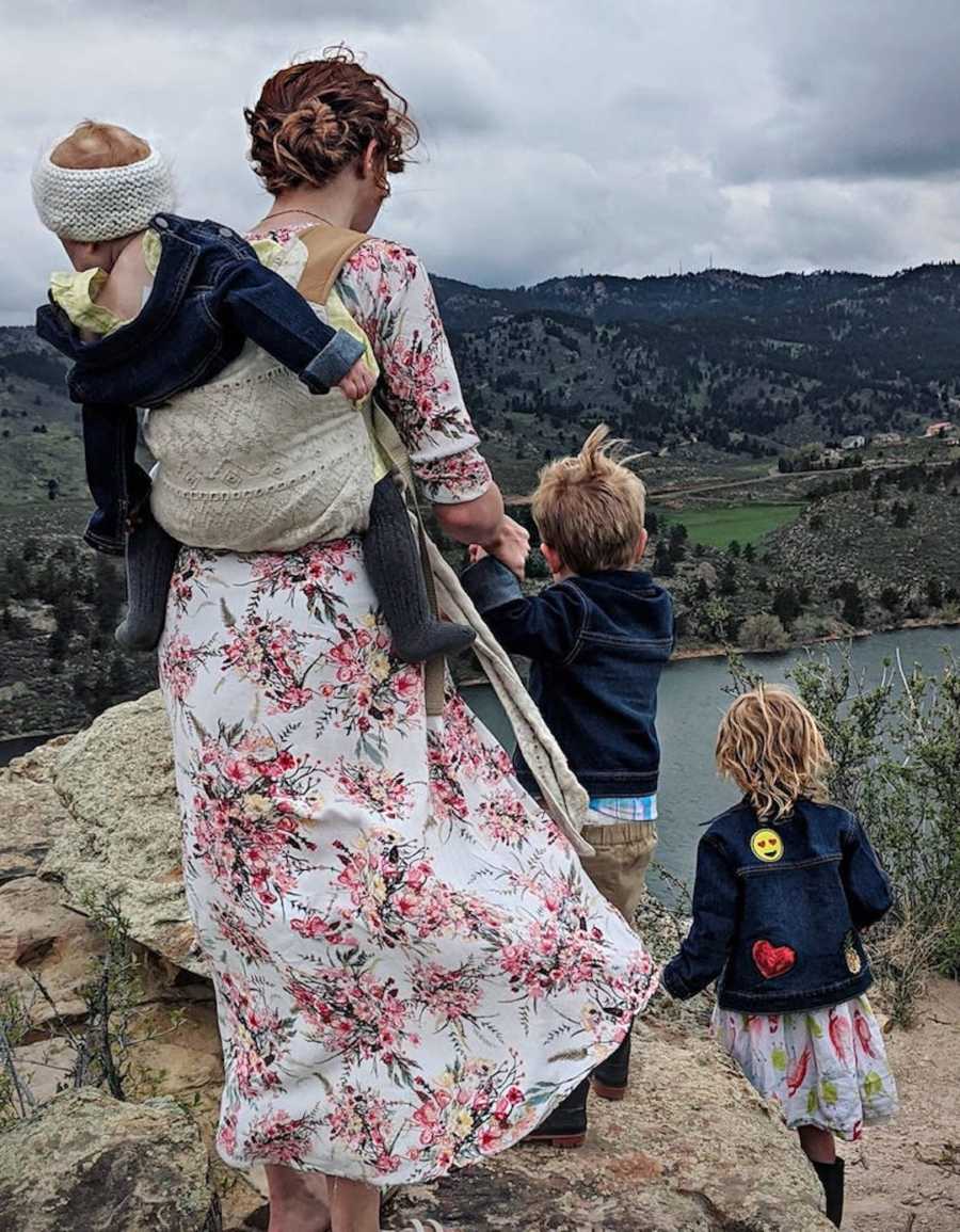 family portrait in front of natural landscape