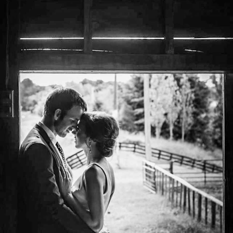 Happy couple embrace and gaze into each others' eyes during a photoshoot