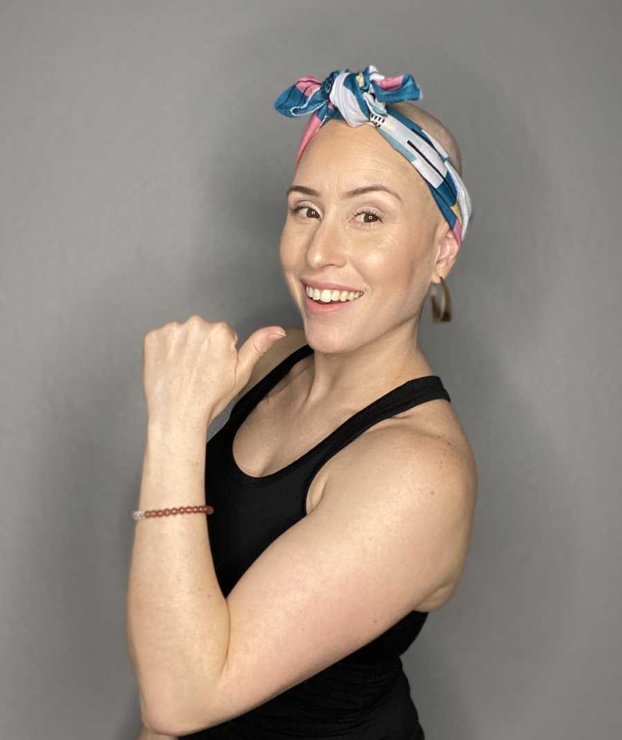 bald woman with bandana around her head