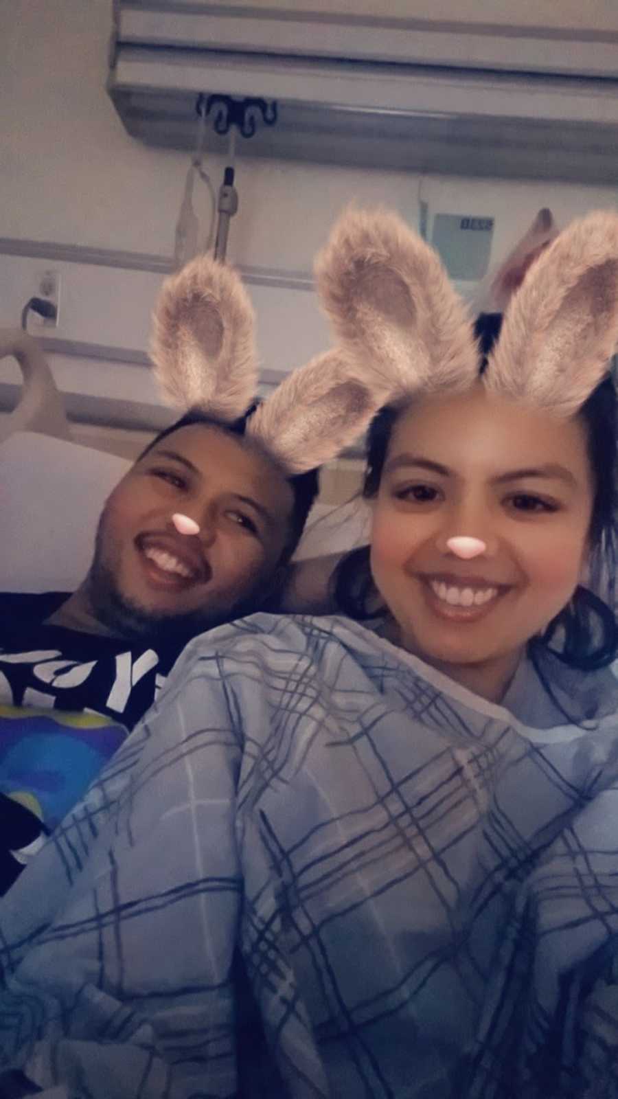 couple smiling with a snapchat filter on