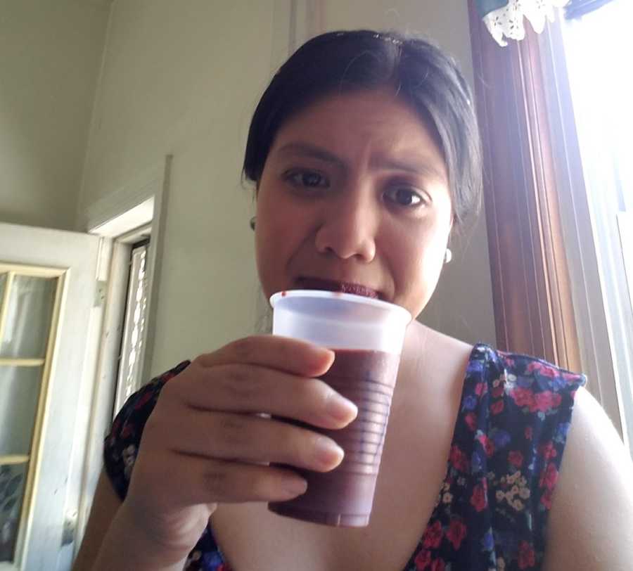 woman drinking a smoothie