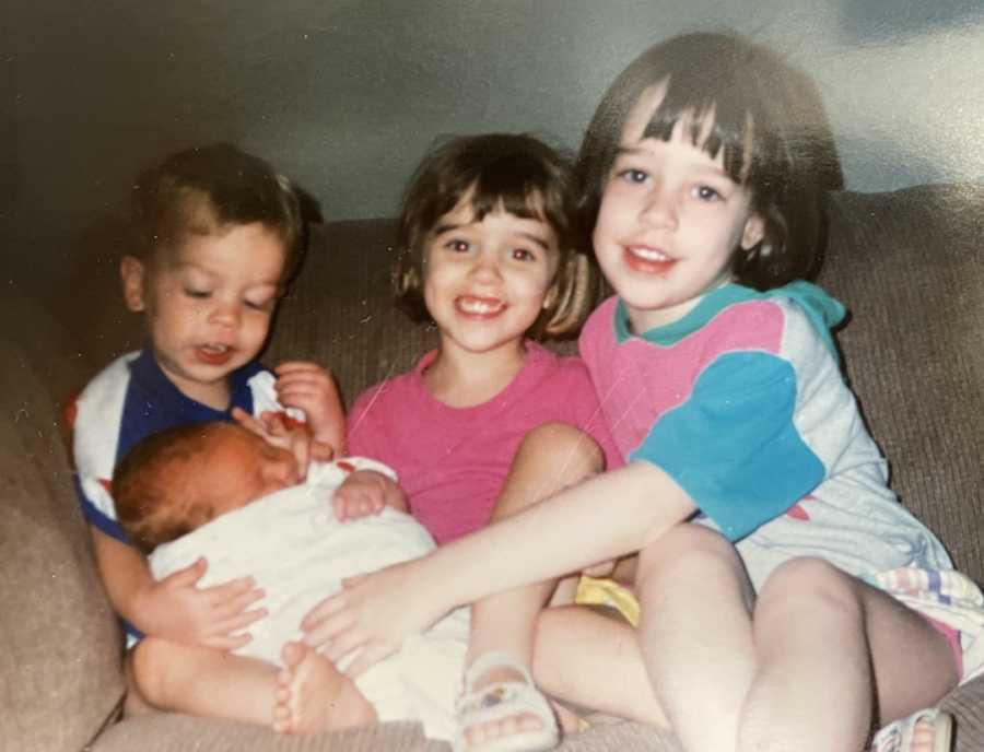 siblings on a couch together