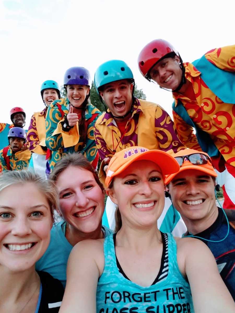 Couple pose for a photo after completing the Dopey Challenge run at Disney