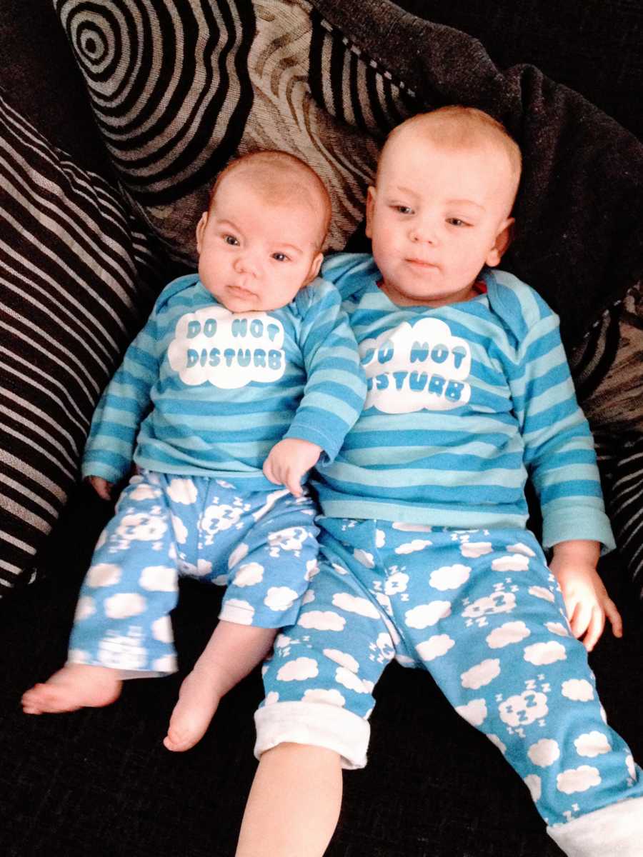 Young brothers wear matching pajamas that say "Do not disturb"
