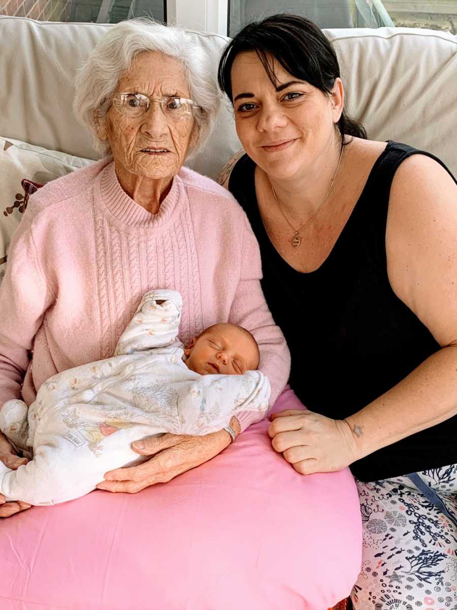 Woman poses with her grandmother and her newborn baby boy