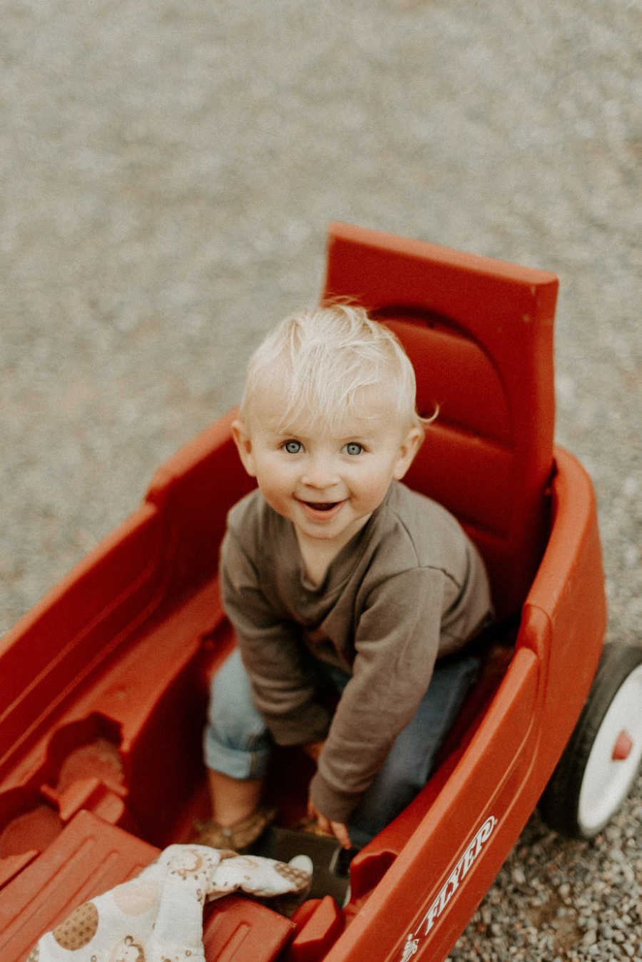 Toddler with Angelman Syndrome with toy car