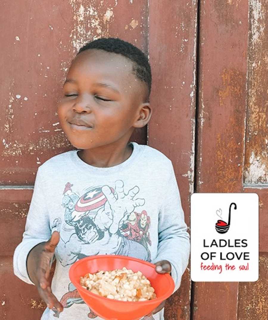 Boy happy eating his soup