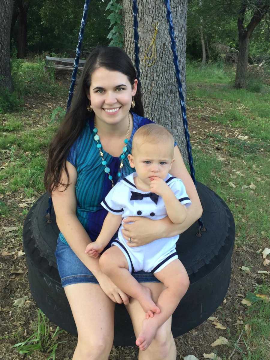 woman and her son on a tire swing
