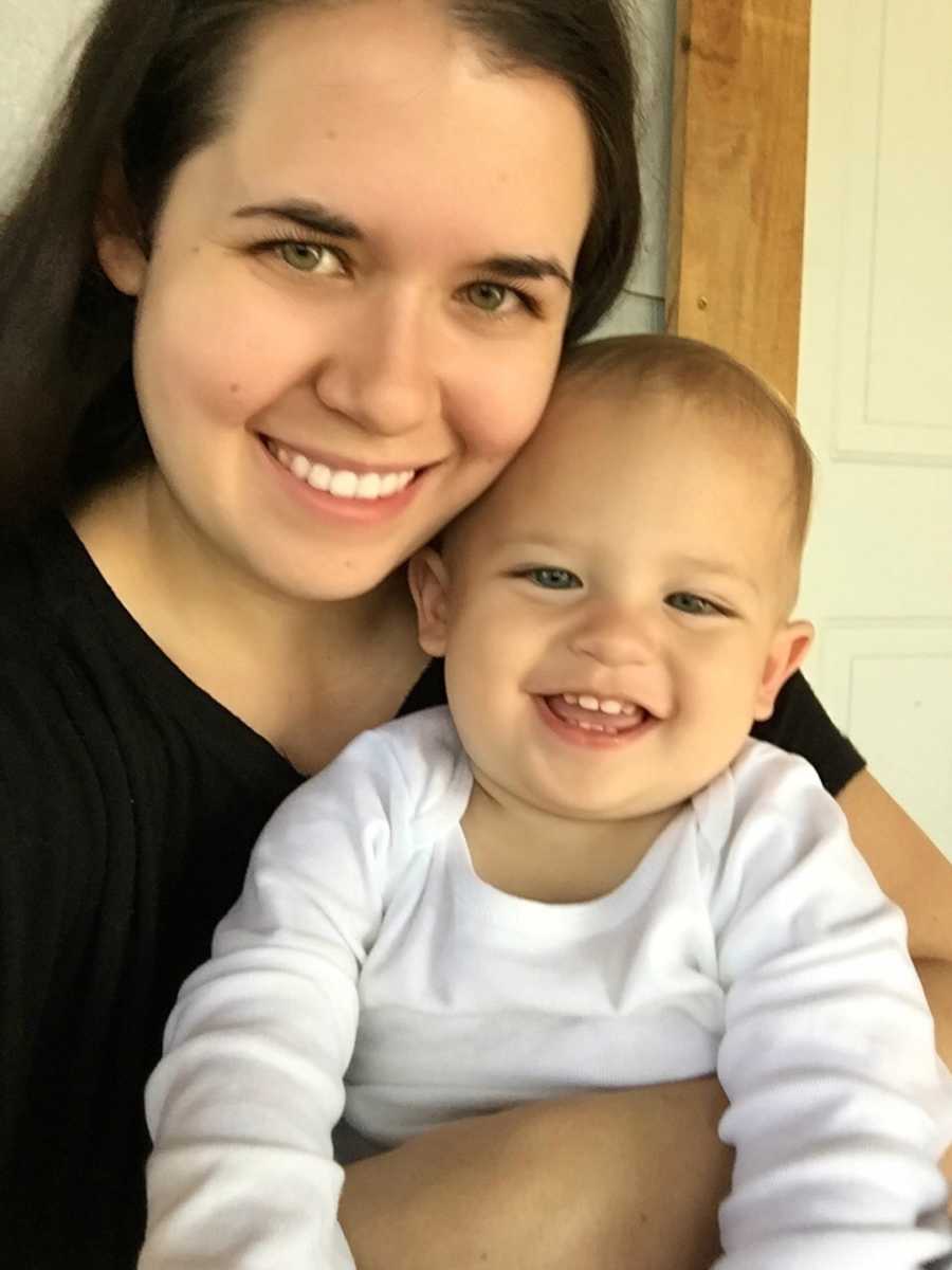 Mom holding infant son