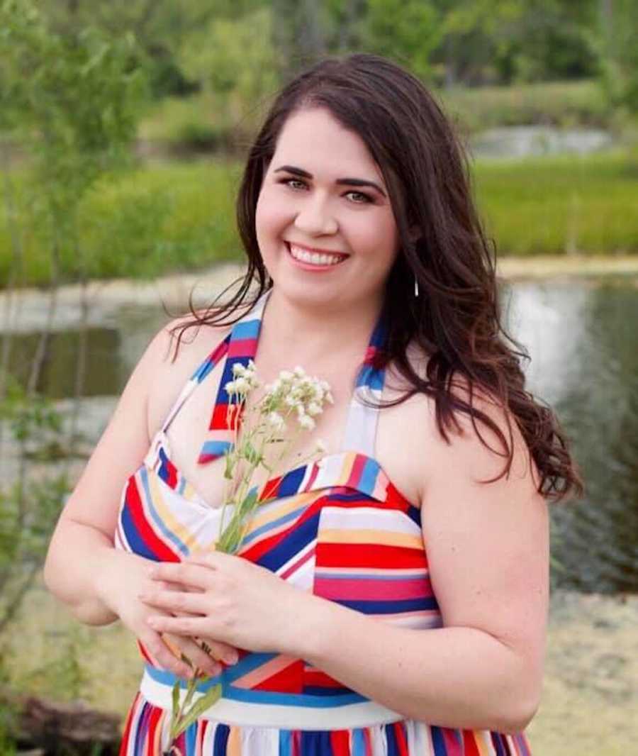 woman smiling with bouquet