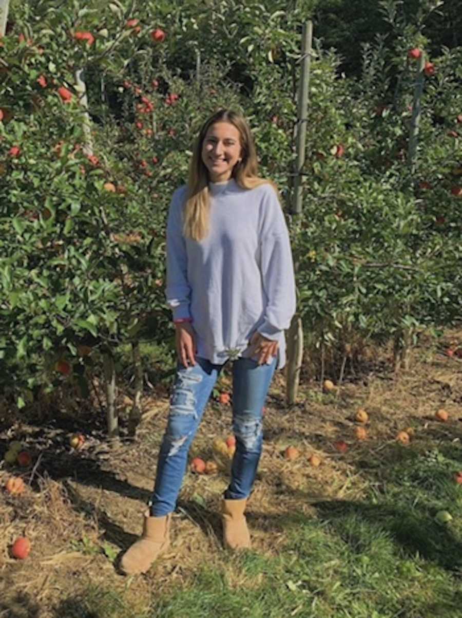 girl in apple field