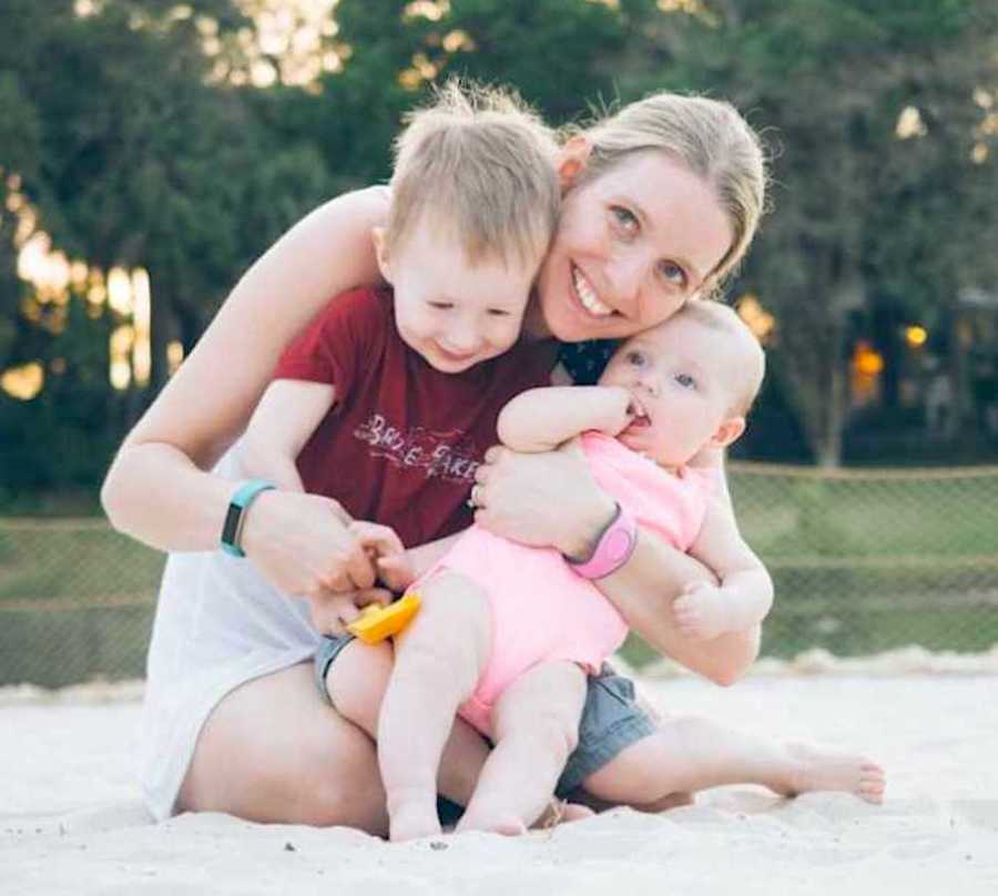 Mom smiling with two kids