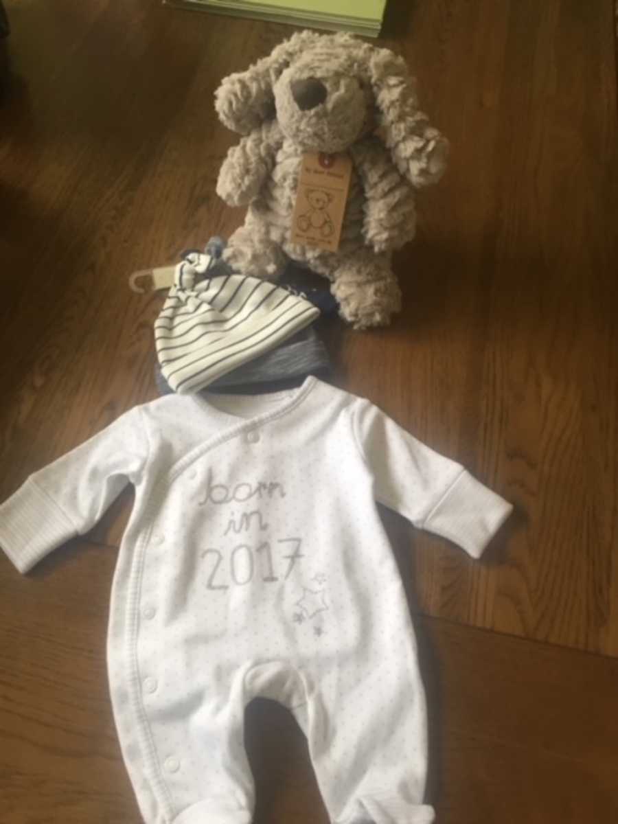 Baby clothes and stuffed animal