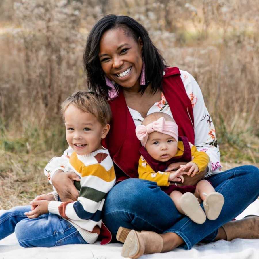 Mom holding two kids