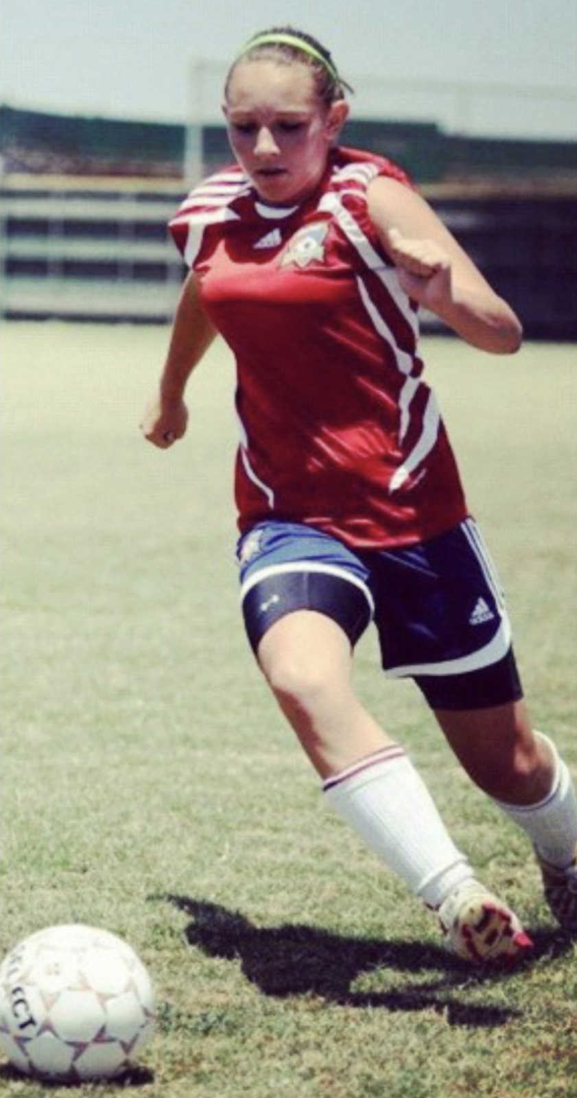 young girl playing soccer