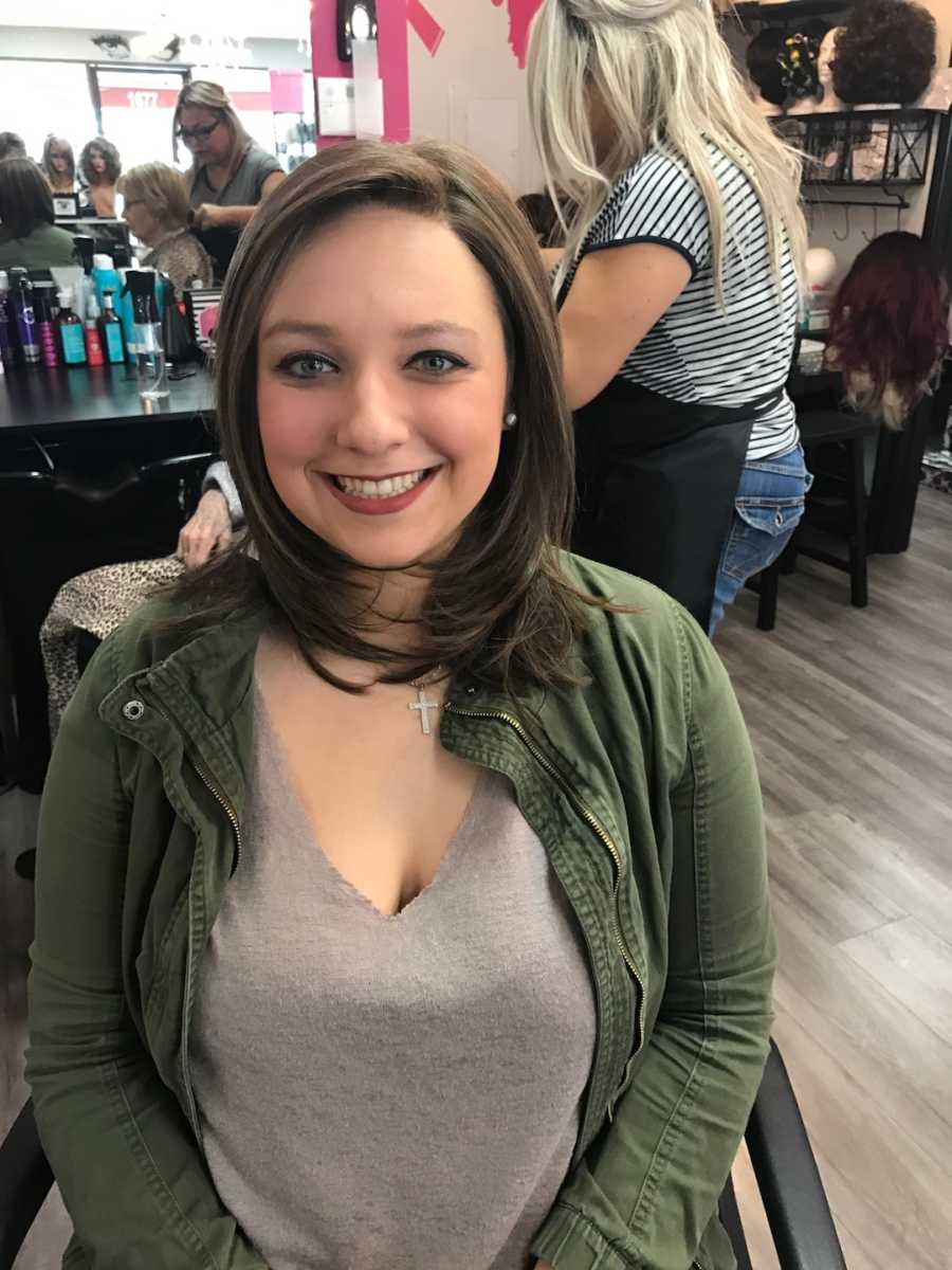 young girl getting fitted for a wig