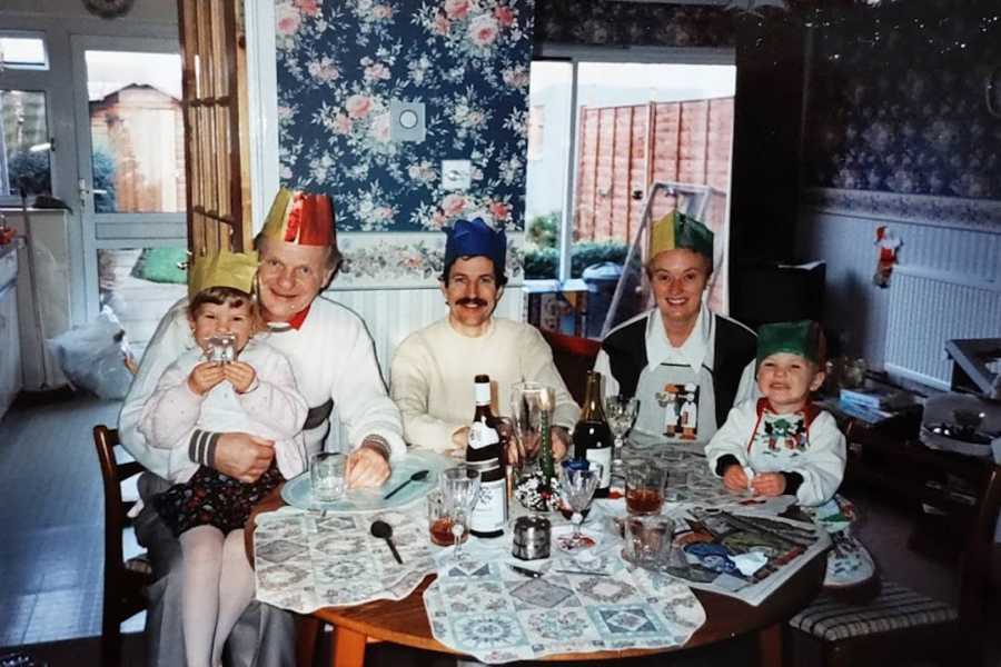 young girl celebrating with family