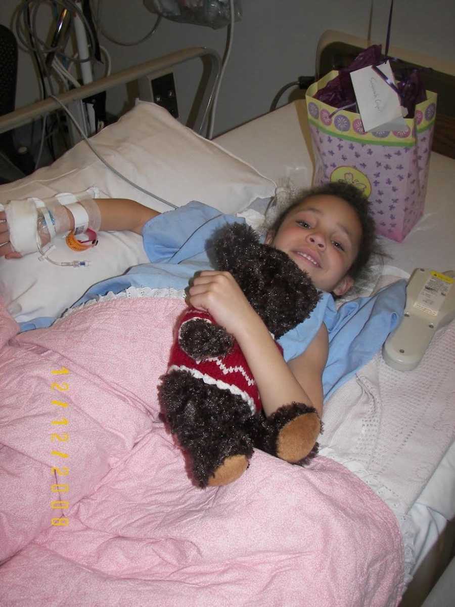 Little girl in the hospital holding teddy bear