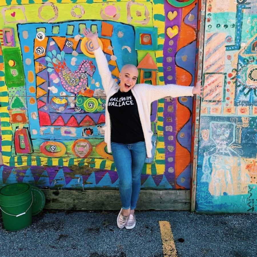 Woman posing in front of colorful background