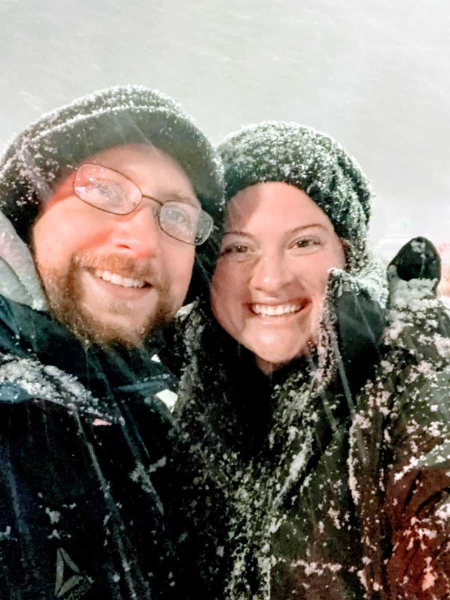 Married couple take a selfie out in the snow during a snowstorm