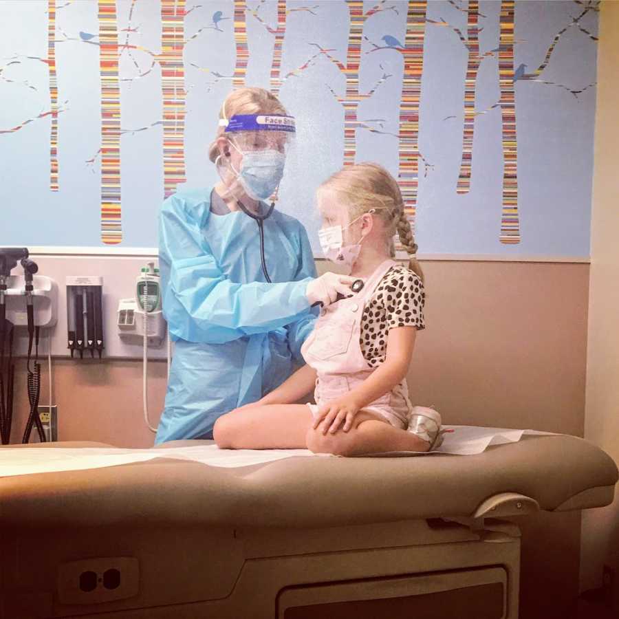 Young girl getting checked out by doctor at hospital