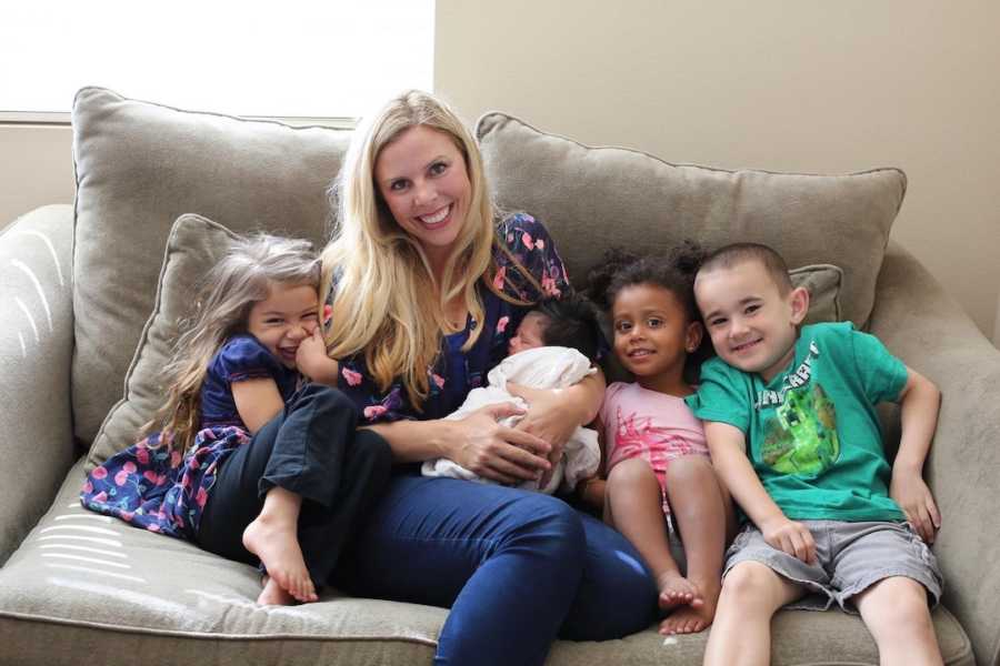 smiling family on couch