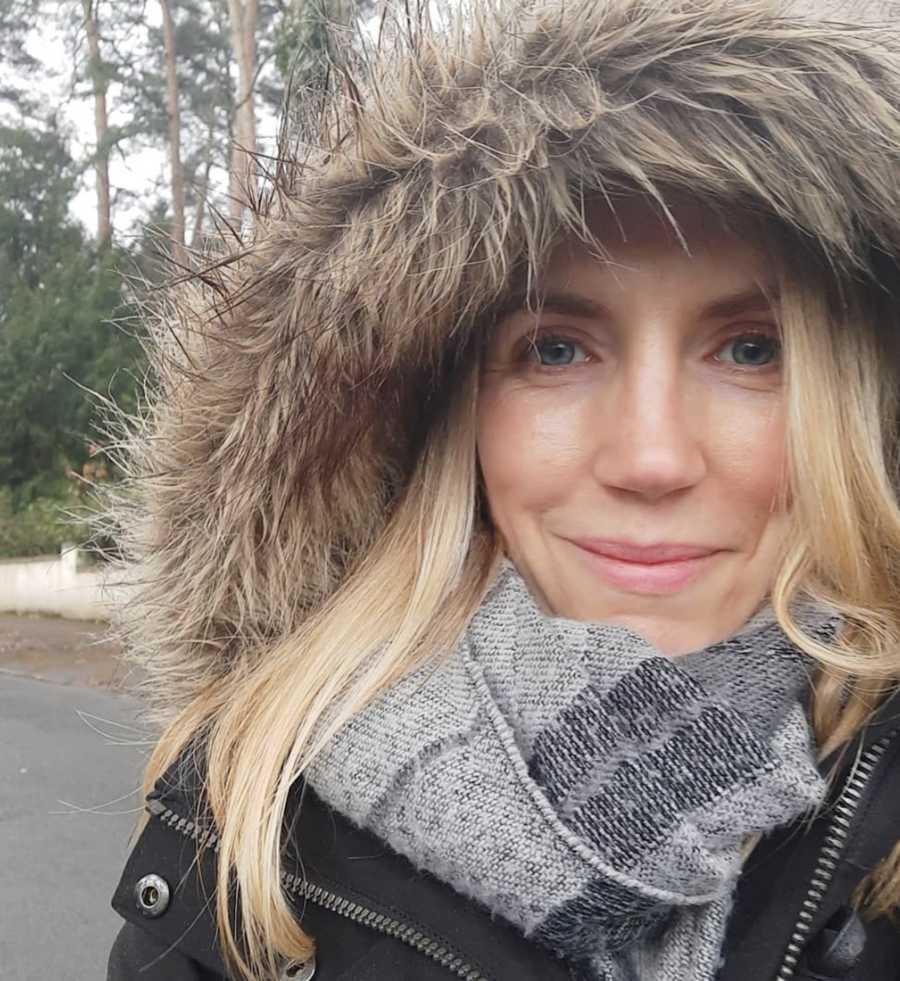 woman smiling in winter coat
