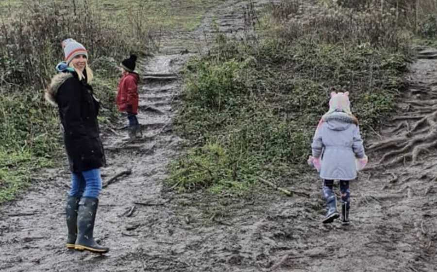 woman hiking with kids