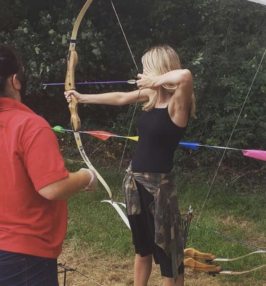 woman doing archery