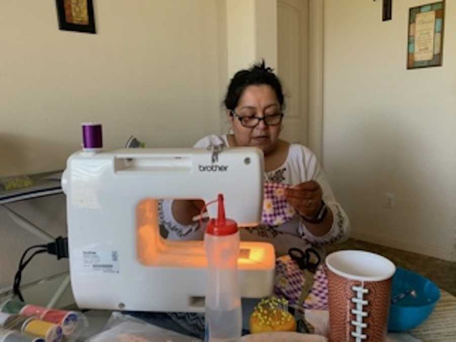 woman sewing masks