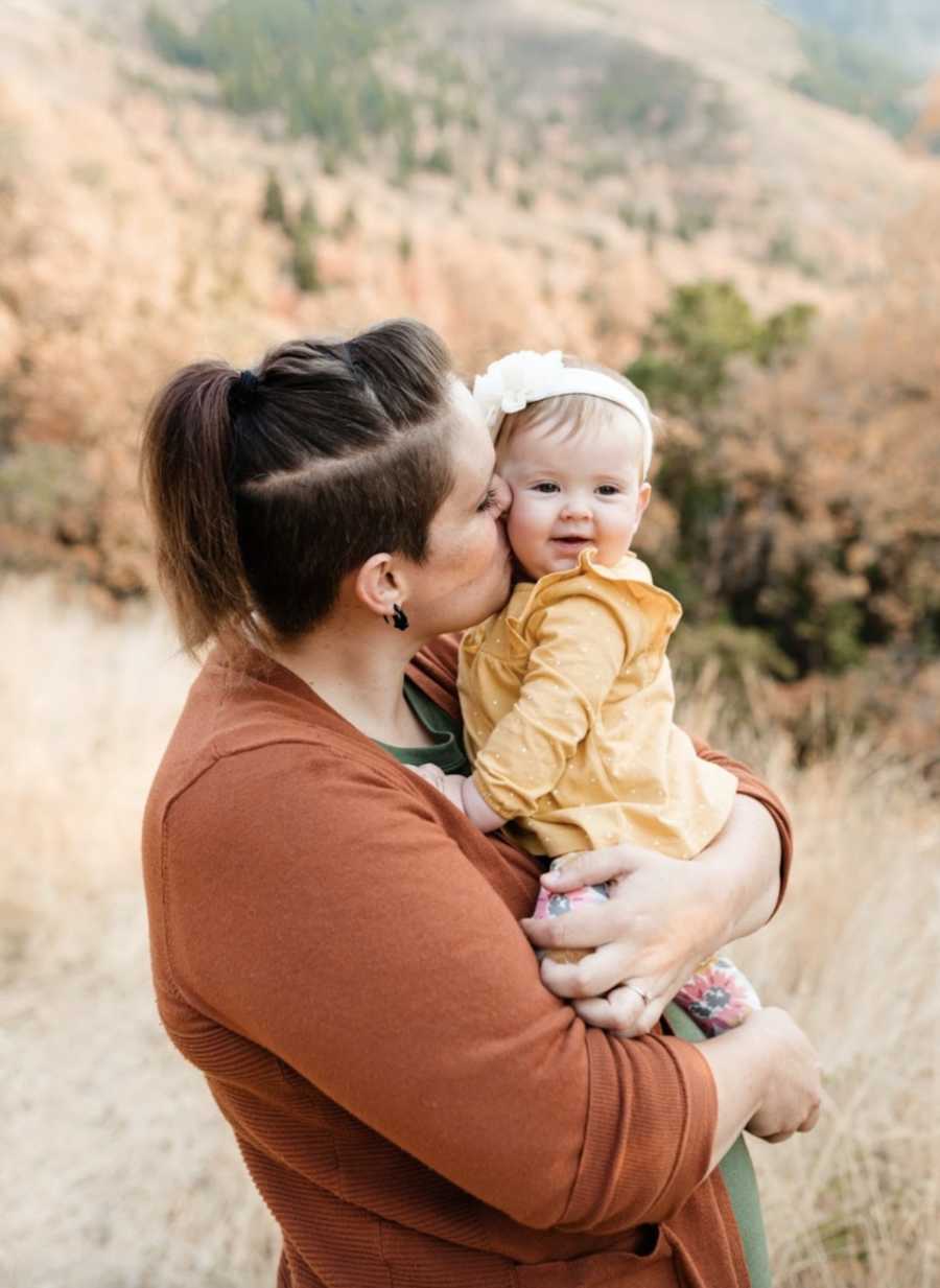 smiling mom holding her baby