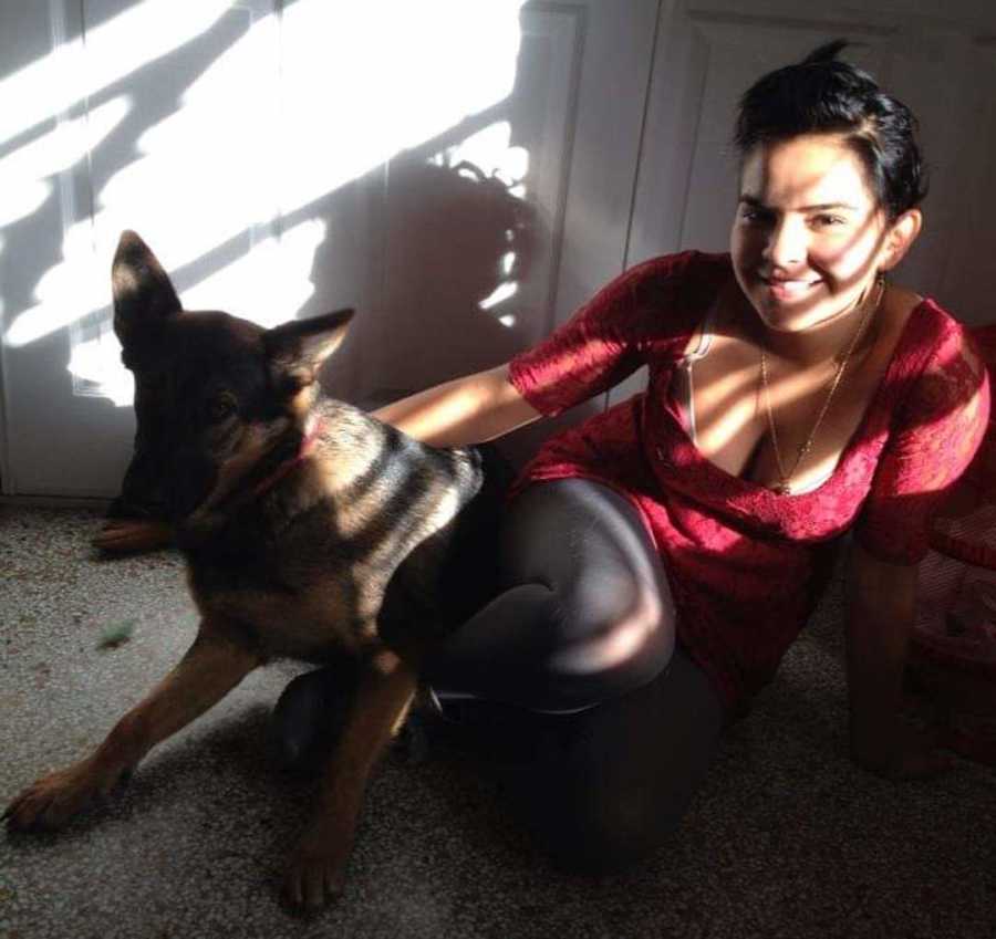 girl posing with a dog