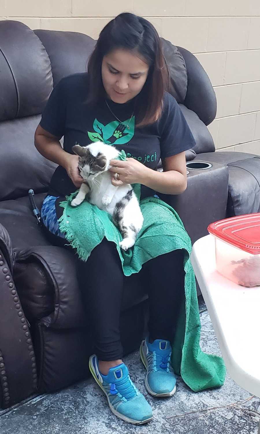 woman with a cat on her lap