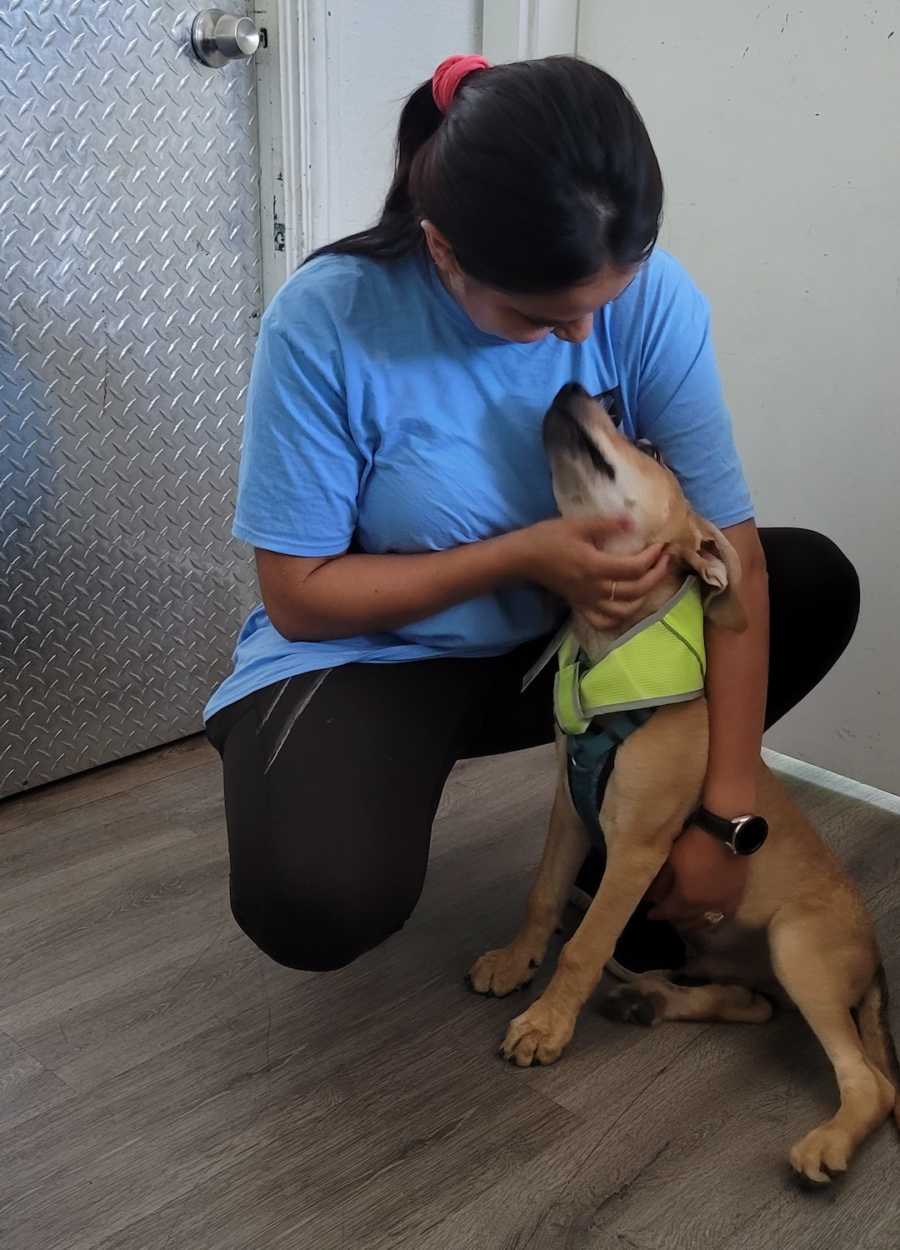 woman posing with a dog