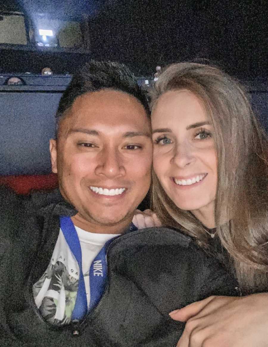 Husband and wife take a selfie at a movie theater