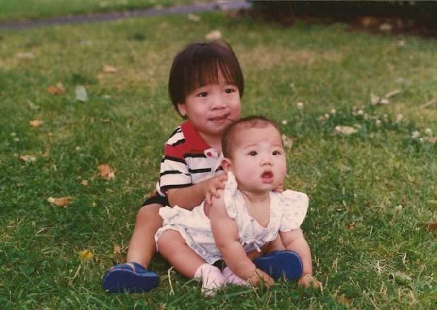 two siblings outside