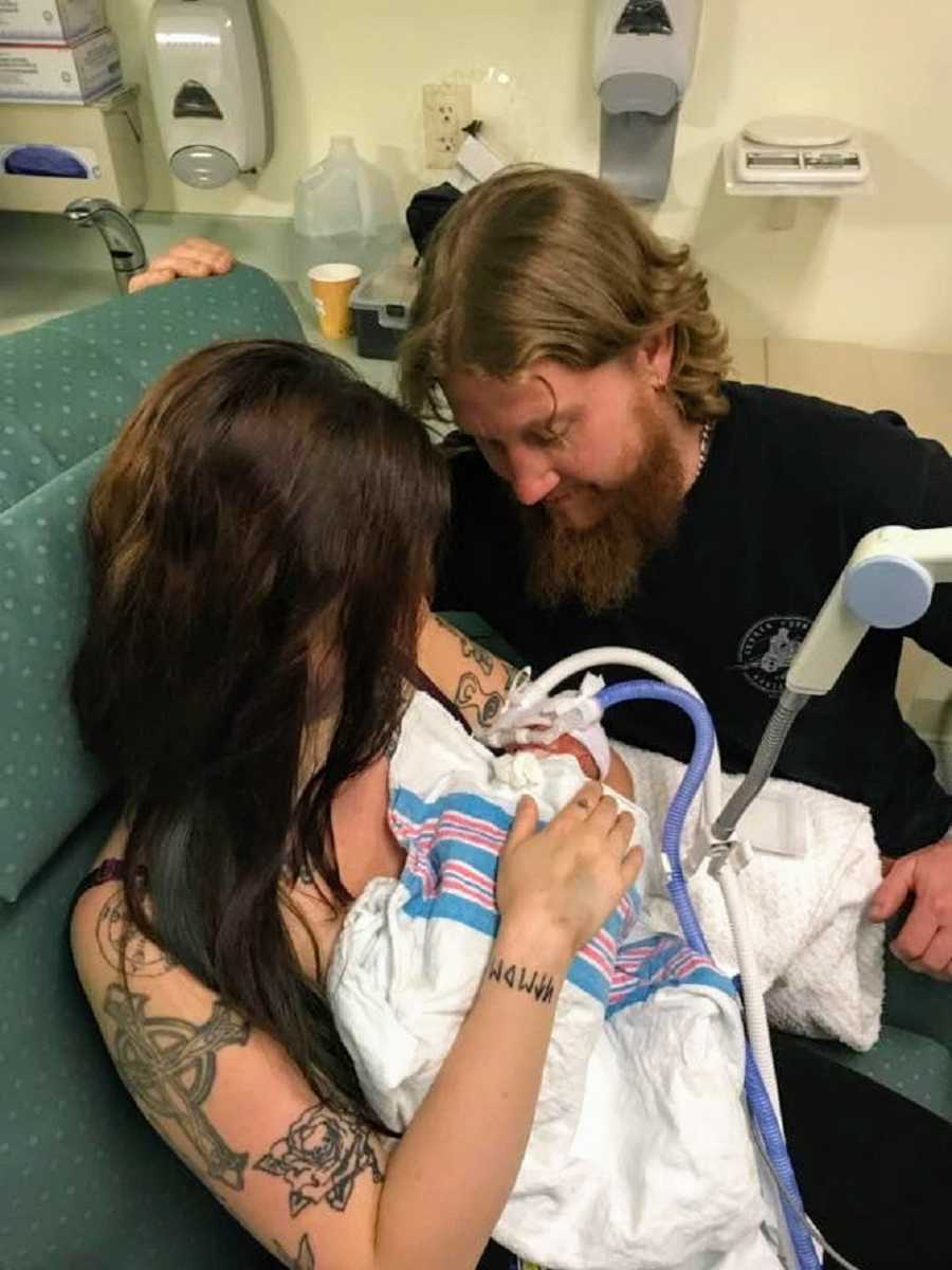 Mother and father with preemie after giving birth