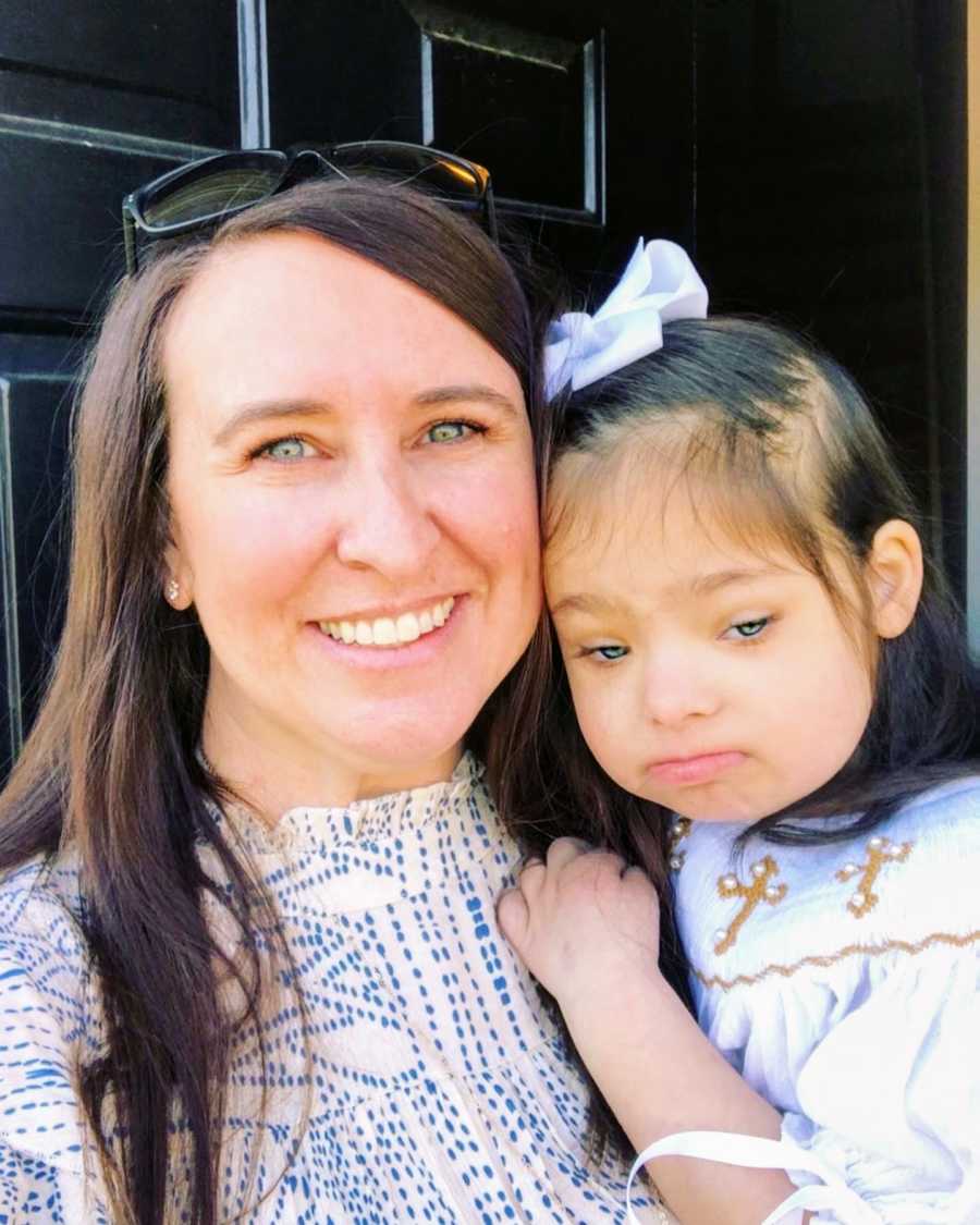 An adoptive mother and her daughter with Down Syndrome