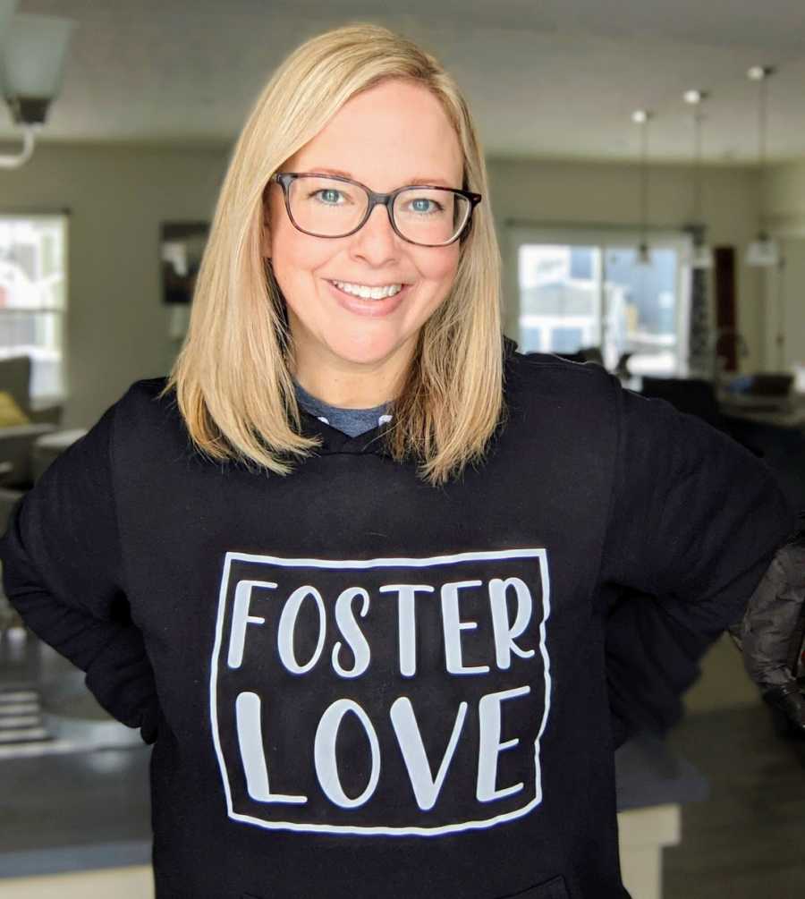 Foster mom smiling wearing foster love t-shirt