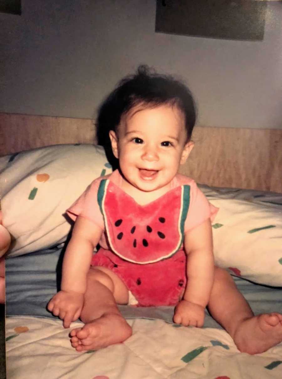 Baby smiling wearing shirt with a watermelon on it