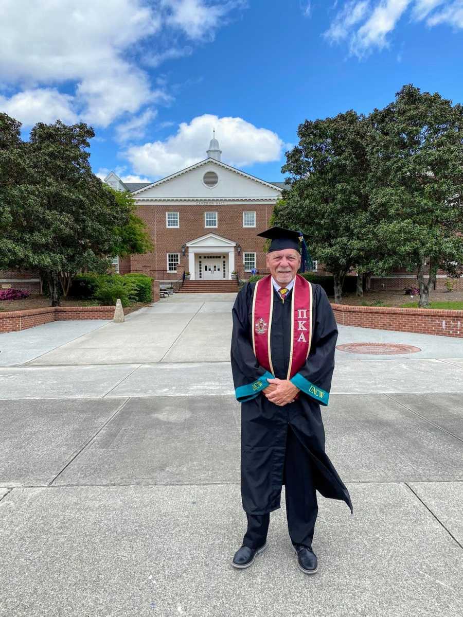 A nontraditional college graduate wearing cap and gown