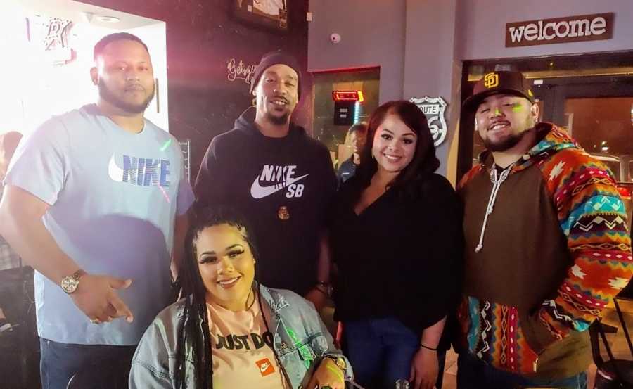 An adult adoptee with his biological sisters and brothers-in-law