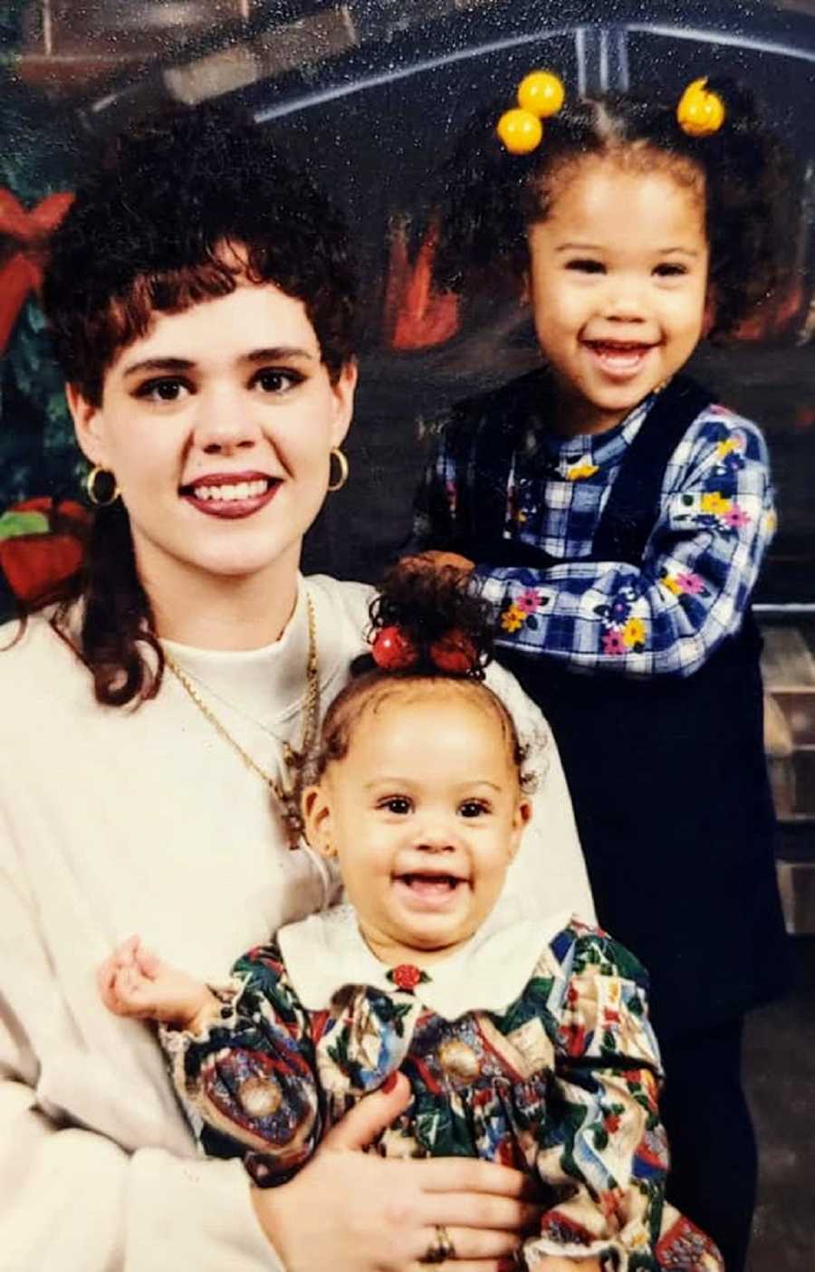 A young mother with two of her daughters