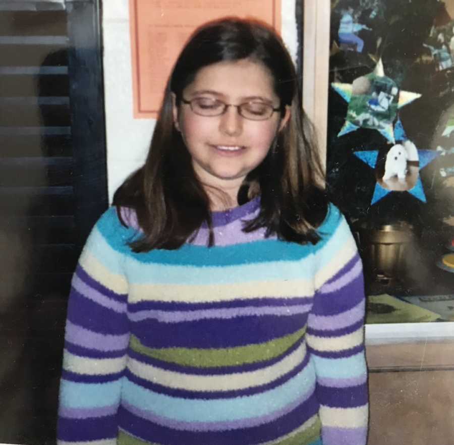 young girl in glasses