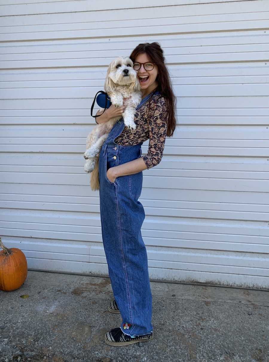 girl holding a dog